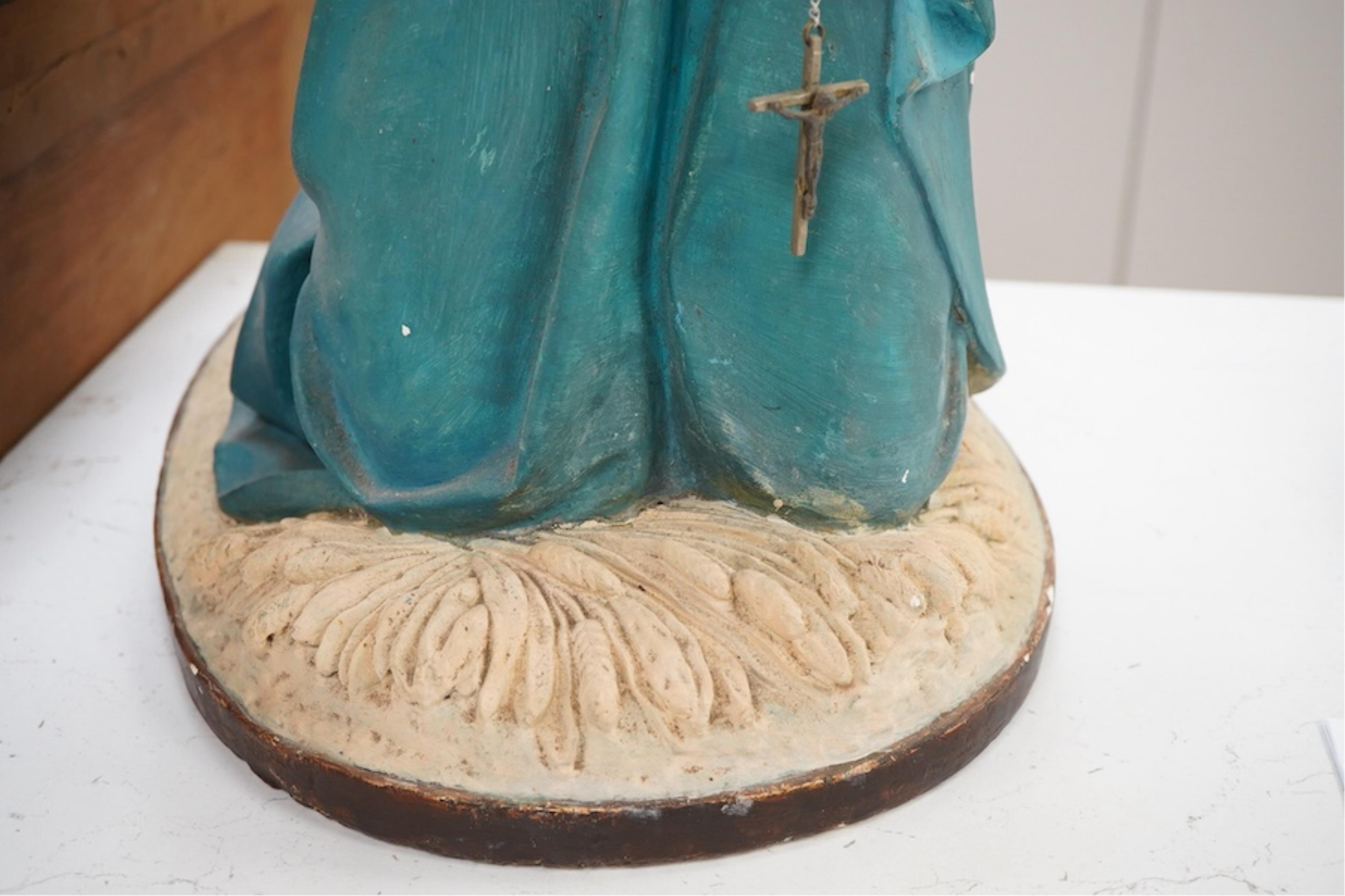 A plaster figure of Madonna at prayer, 61cm